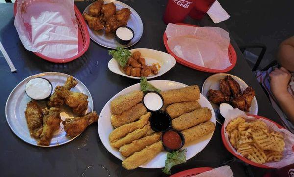 Spicy lemon pepper, baker's gold, buffalo bites, appetizer sampler, maple chipotle, waffle fries (left to right)