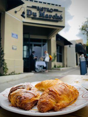 Left: almond croissant  Right: plain croissant  Back: Apple turnover