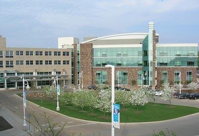 Front View coming in. Parking Ramp on left and main entrance center.