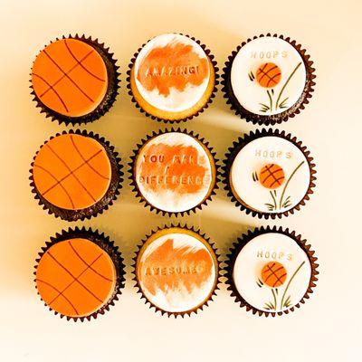 Simple chocolate and vanilla cupcakes with custom made basketball fondant toppers