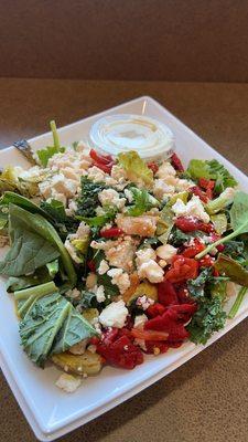 A Salad Creation of Your Own mixed greens base with chicken, turkey, Brussels sprouts, roasted peppers, and ranch