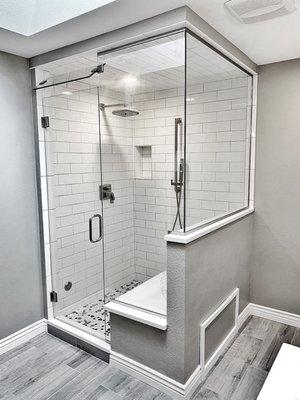 Glass shower enclosure. Steam shower with operable transom glass installed in Denver, Colorado.