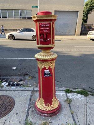 Still working fire Alarm box outside near bar