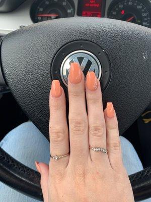 Gel nails in "peachy" with gems on ring finger. Super fun!