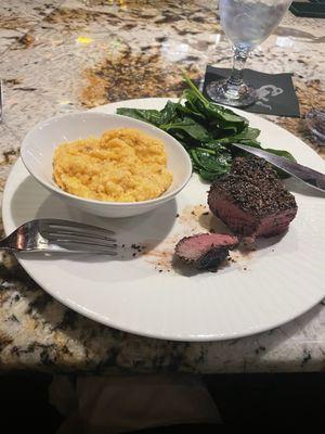 Pepper crusted filet mignon, spicy cheddar prosciutto grits, and sautéed spinach.