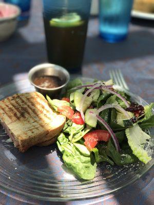 Menu Item: "half sandwich & side," featuring 1/2 "the reuben" + "petite signature café salad"