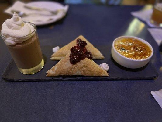 Trio dessert platter. Crème brûlée, berry stuffed pastry, and chocolate mousse