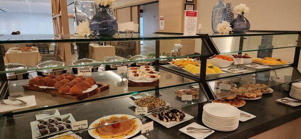 fruits, pastries, cinnamon malassada, creme brulee, flan, cakes