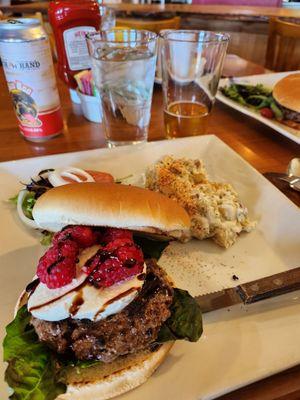 Chef's monthly feature- basil leaves, mozzarella,  raspberries with balsamic drizzle.