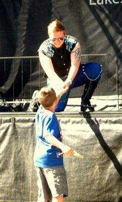 Mister Phoenix Gay Pride 2011 Freddy Prinze Charming and a young fan, on the Community Stage, Pride 2011.