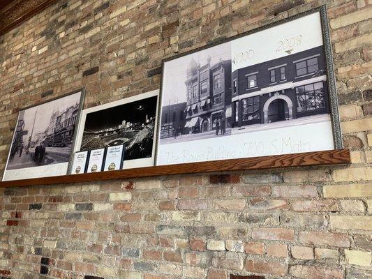 Exposed brick with the photo of the building from 1900. Very cool