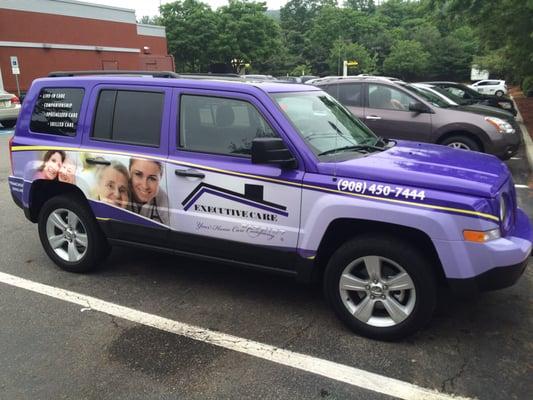 Pictures of the company vehicle and franchise signing.