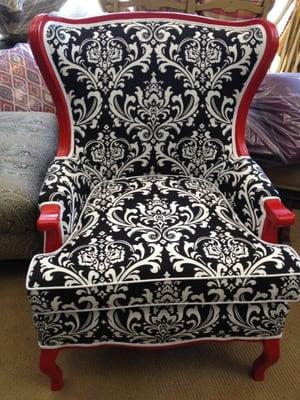 Beautiful custom red chair with white piping.