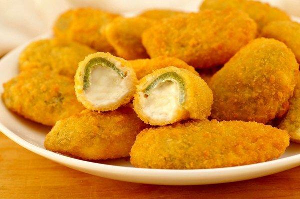 (10 Pieces) jalapeno poppers staff with cheddar cheese server with homade marinara sauce or ranch. dressing