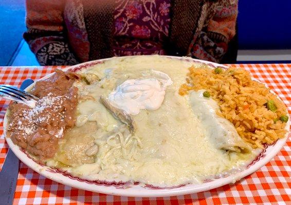 Chicken Enchiladas Suizas (queso fresco) fancy rice and Cojito queso topped beans.