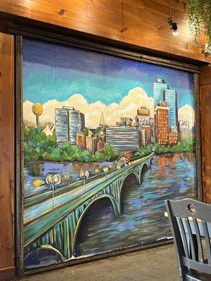 Beautiful mural of downtown Knoxville on a wall.