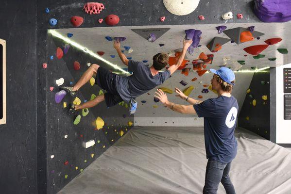 Climbing the indoor rock climbing cave