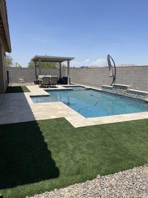 Side view to show pergola, turf and granite landscaping.