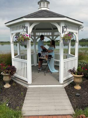 Beautiful gazebo next to the water.