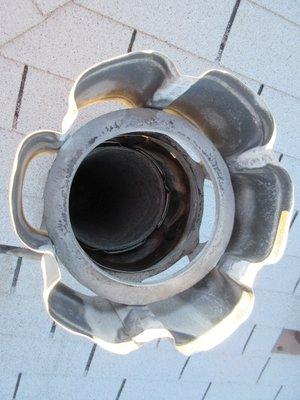 The cap was missing at the exhaust vent from the furnace and water heater.  You could not see this from the ground.