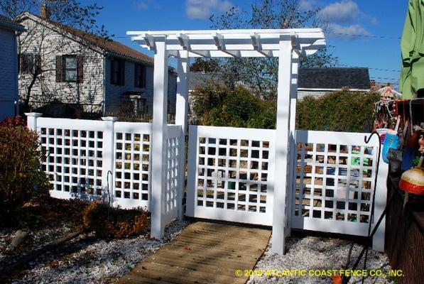 4 ft Old English Lattice White Vinyl Fence and Pergola with matching gate.