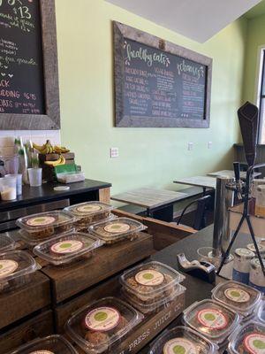 View of goods at counter and some seating