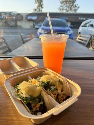 2 Al Pastor tacos with fresh made tortillas, papaya agua fresca