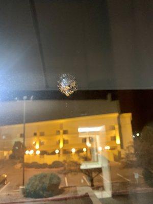 Bullet hole on window