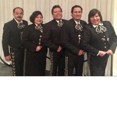 Mariachi Universal posing for a picture after their performance at The Loft Events Center.