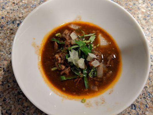 A small scoop of the birria de res