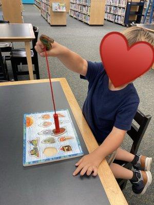 My son enjoying their Hungry Caterpillar puzzle.