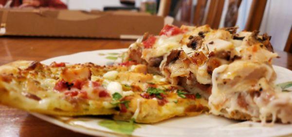 Artisan thin pizza next to the thick deep dish slice pizza on the right.