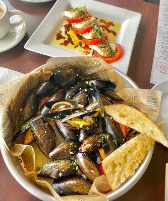 Delicious mussels and good caprese salad.