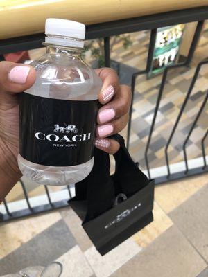 Coach complimentary water and small gift bag