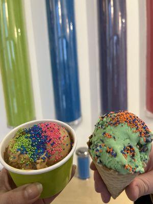 Coffee toffee kid's scoop and mint chip in a waffle cone. In front of the free sprinkle wall!