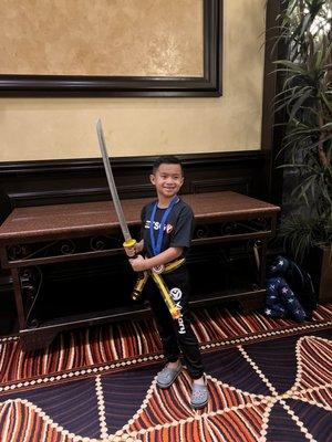 My son earning his first place in a weapons tournament at Santa Fe