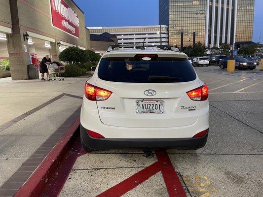 Illegally parked cars in a designated fire  zone'