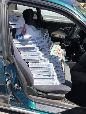 What a dozen pizzas look like in your front seat.