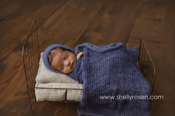 Baby boy blue in little bed