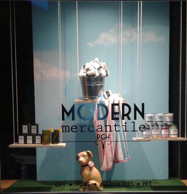 Spring window featuring our private label of locally made Tea, soap, and candles.