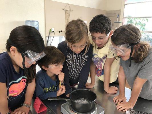 Elementary students conducting a science experiment