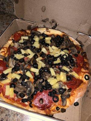 Pepperoni, pineapple, mushrooms and black olives