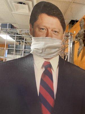 Bill Clinton with a mask at Pop's Resale