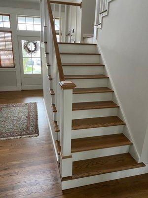 Sanded, stained and refinished Red Oak floors and stair treads in a home in Mantanzas Inlet, FL, by Dan's Floor Store 904.887.8303.