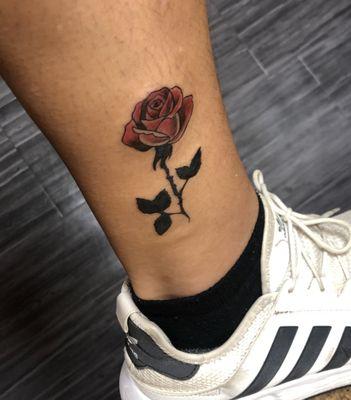 Rose tattoo done by Mez