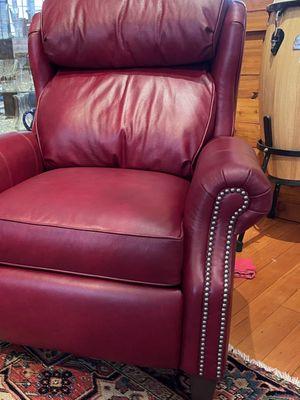 Red leather chair that lounges