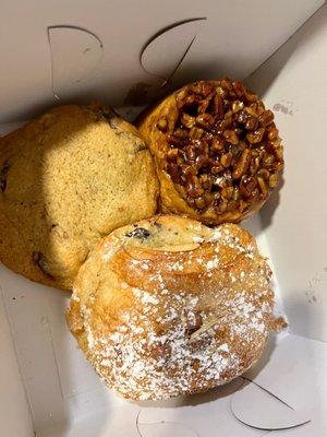 Pecan roll, chocolate almond croissant, and walnut chocolate chip cookie