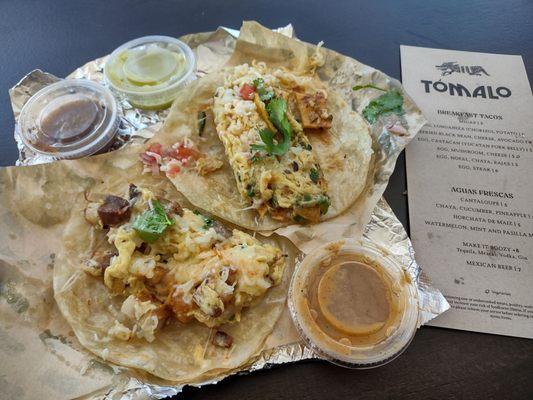 Migas (right) and Yucatan pork belly, egg, and cheese (left)