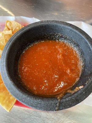 Red salsa. Tastes like tomato sauce and slight heat.