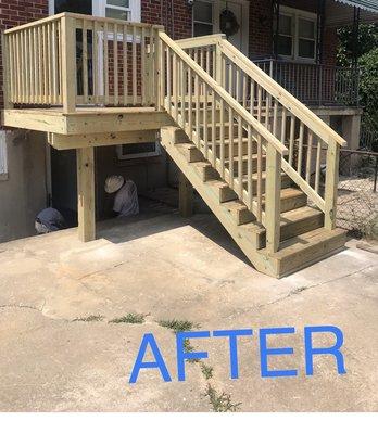 Beautiful solid wood porch and steps! The horrible cement patio will be removed this summer.